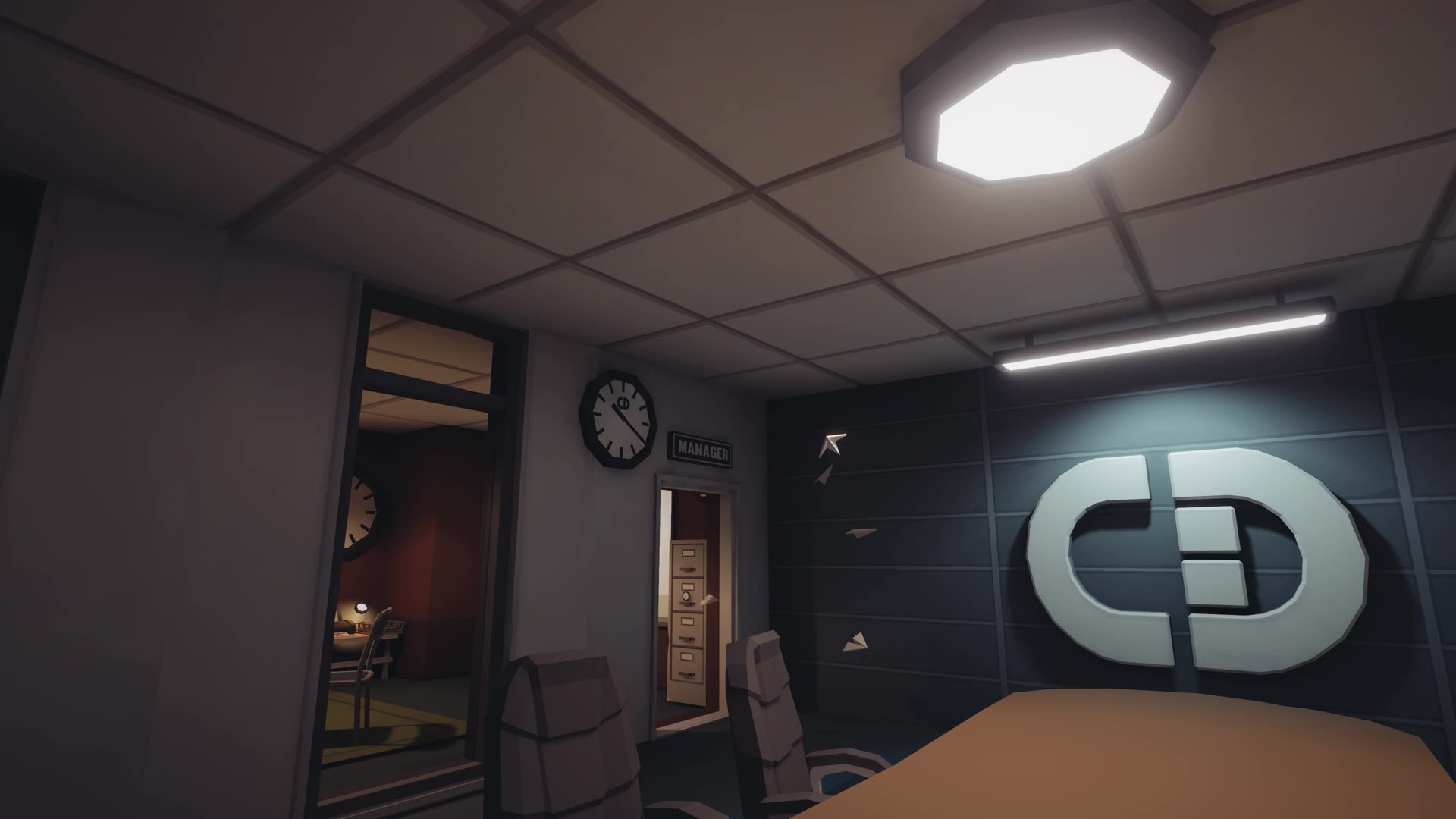 Office interior. The CD mark doubles as in-world wayfinding.